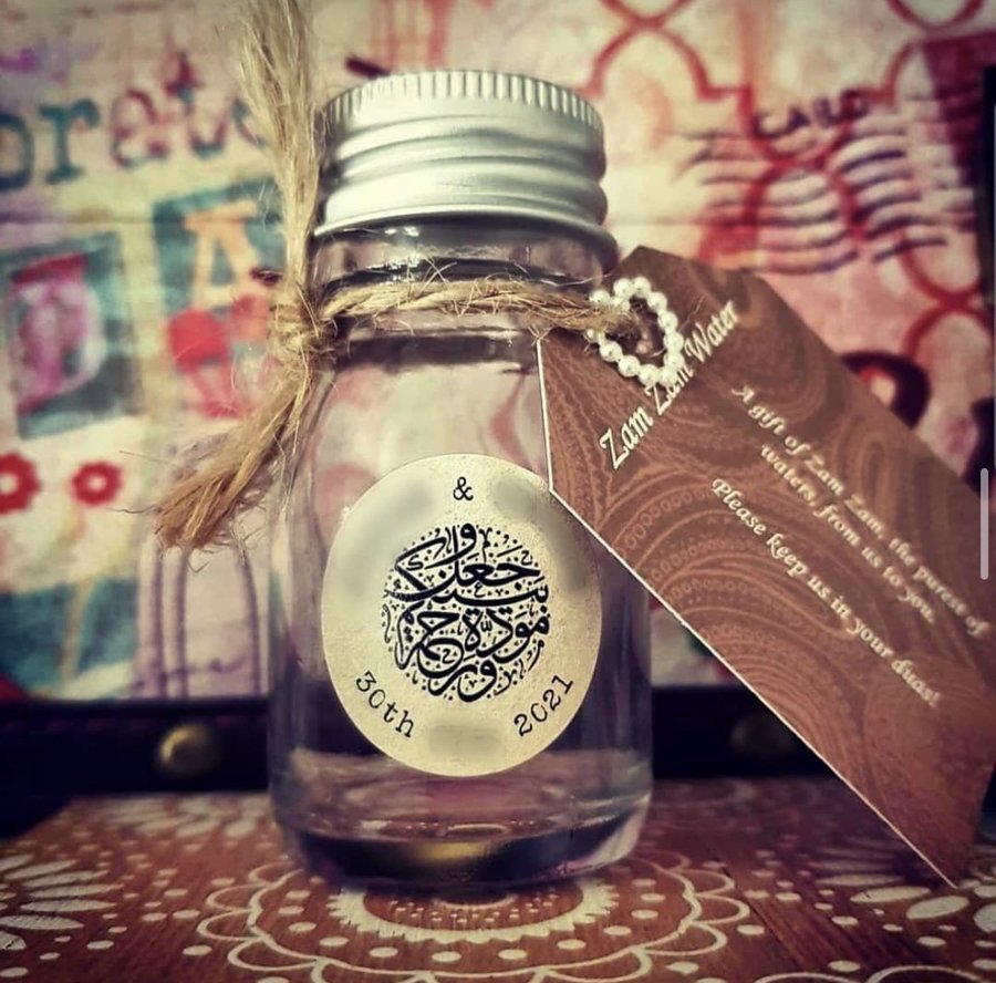50ml glass Zam Zam water favour bottle with a personalised Arabic calligraphy sticker and kraft tag